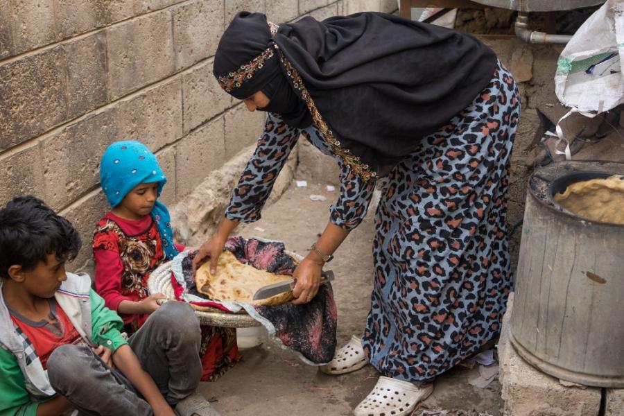 Afrah spends three hours making two pieces of bread for her children. No fuel and only some flour is all they have