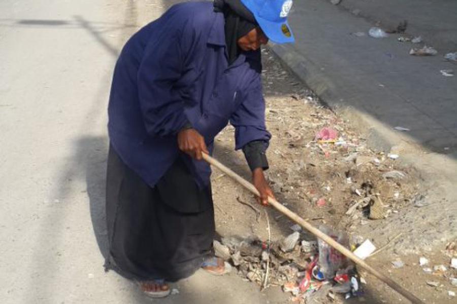 Abeedah, one of the Cleaning and Development Fund staff, participating in the cleaning campaign
