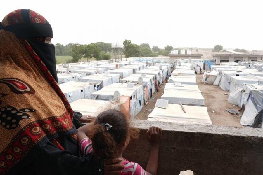 Attikah overlooking the collective centre with her daughter