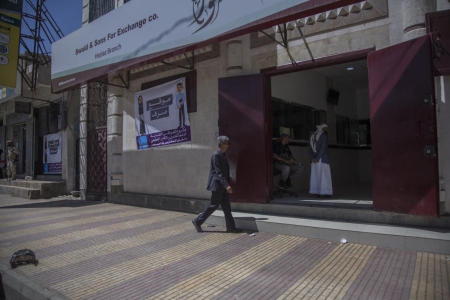 Hamoud entering the cash transfer banking office