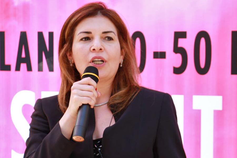 Dina Zorba speaks at an International Women's Day event