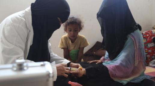 Sahar during a visit to provide services to women in a nearby IDP camp